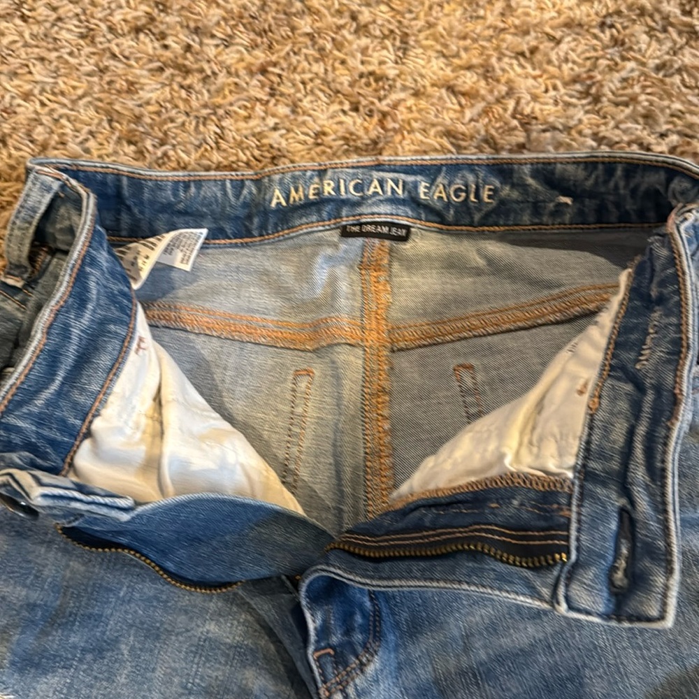 Denim jeans with rips on legs